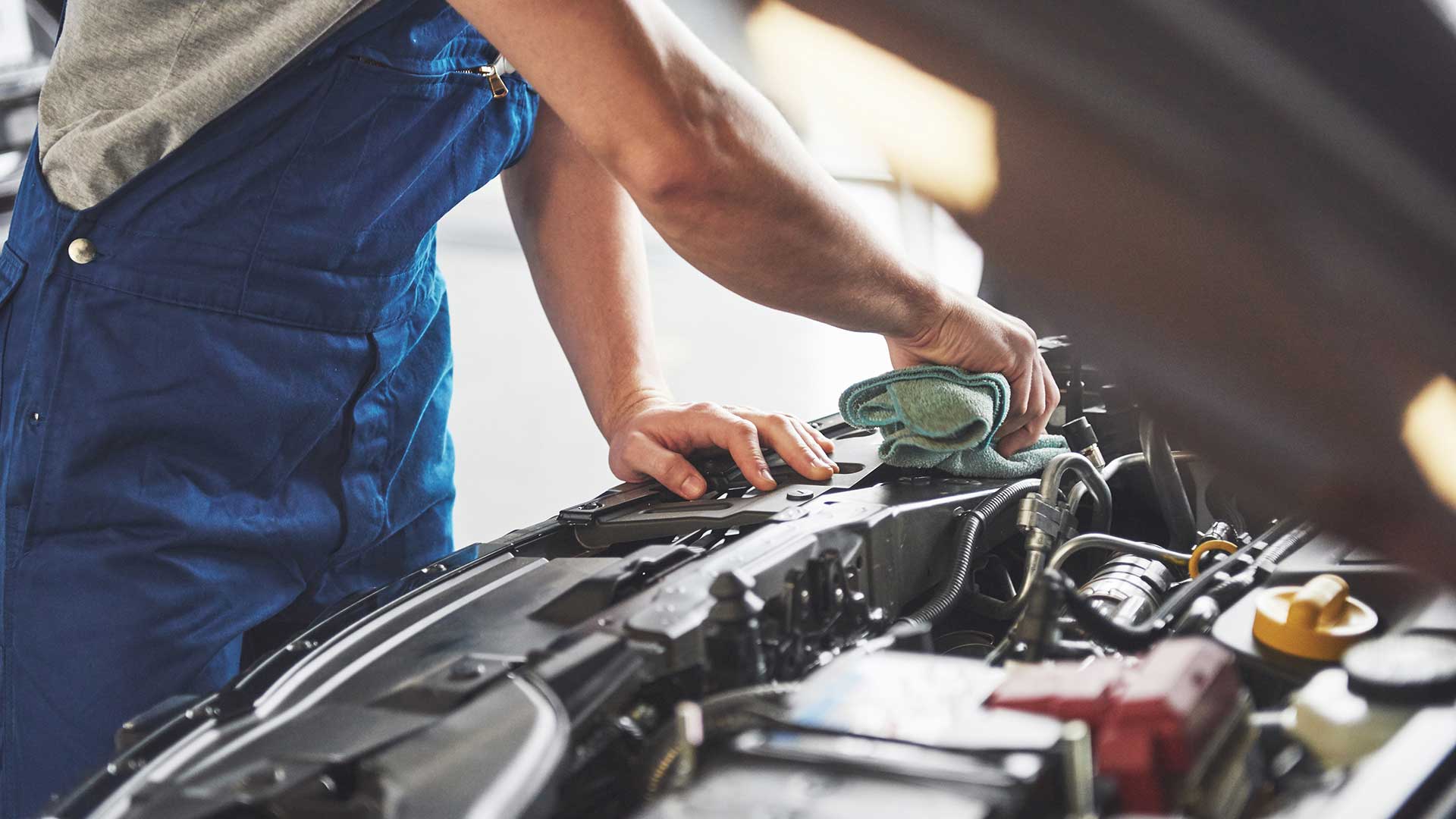 auto-mechanic-working-in-garage-repair-service